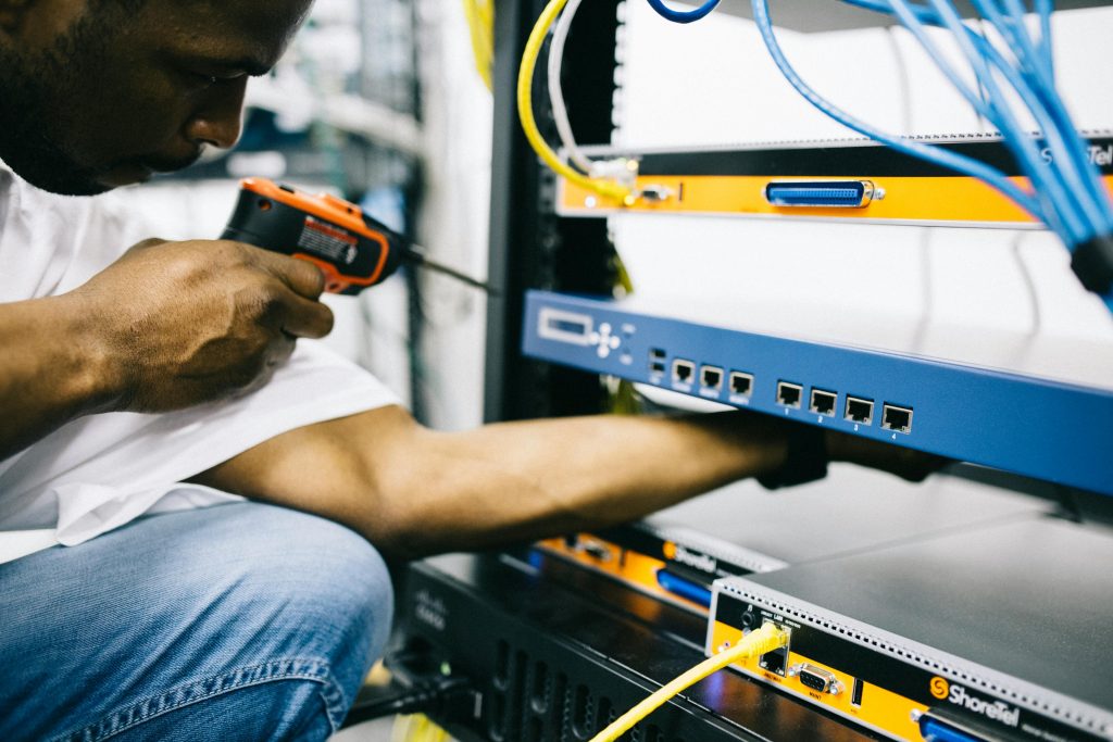 Picture of Technician working on computer server rack