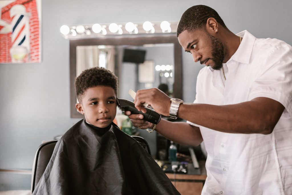 Picture of boy receiving a haircut